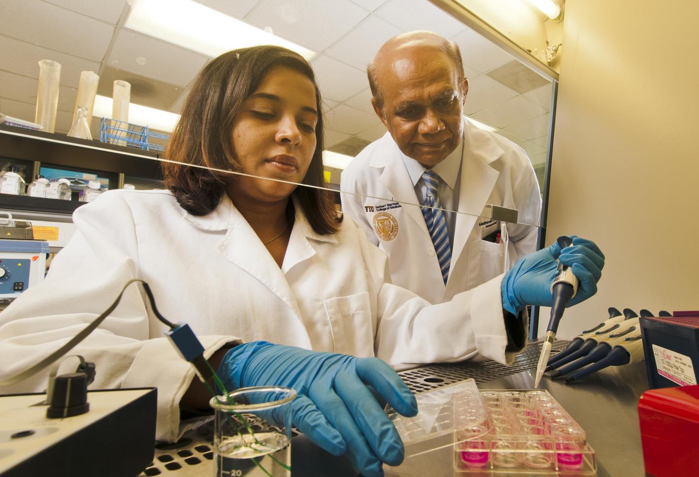 Madhavan Nair and student in lab